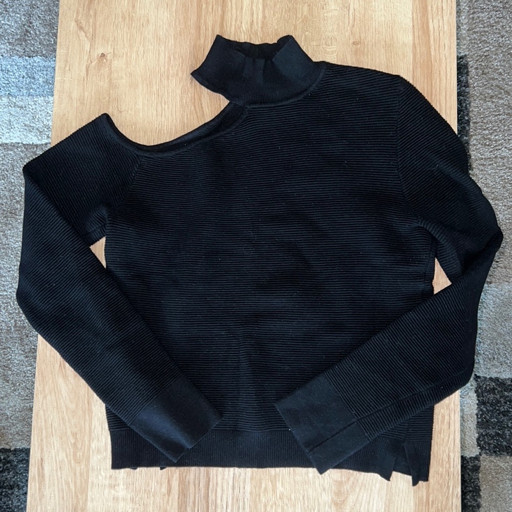 black sweater with shoulder cut out
